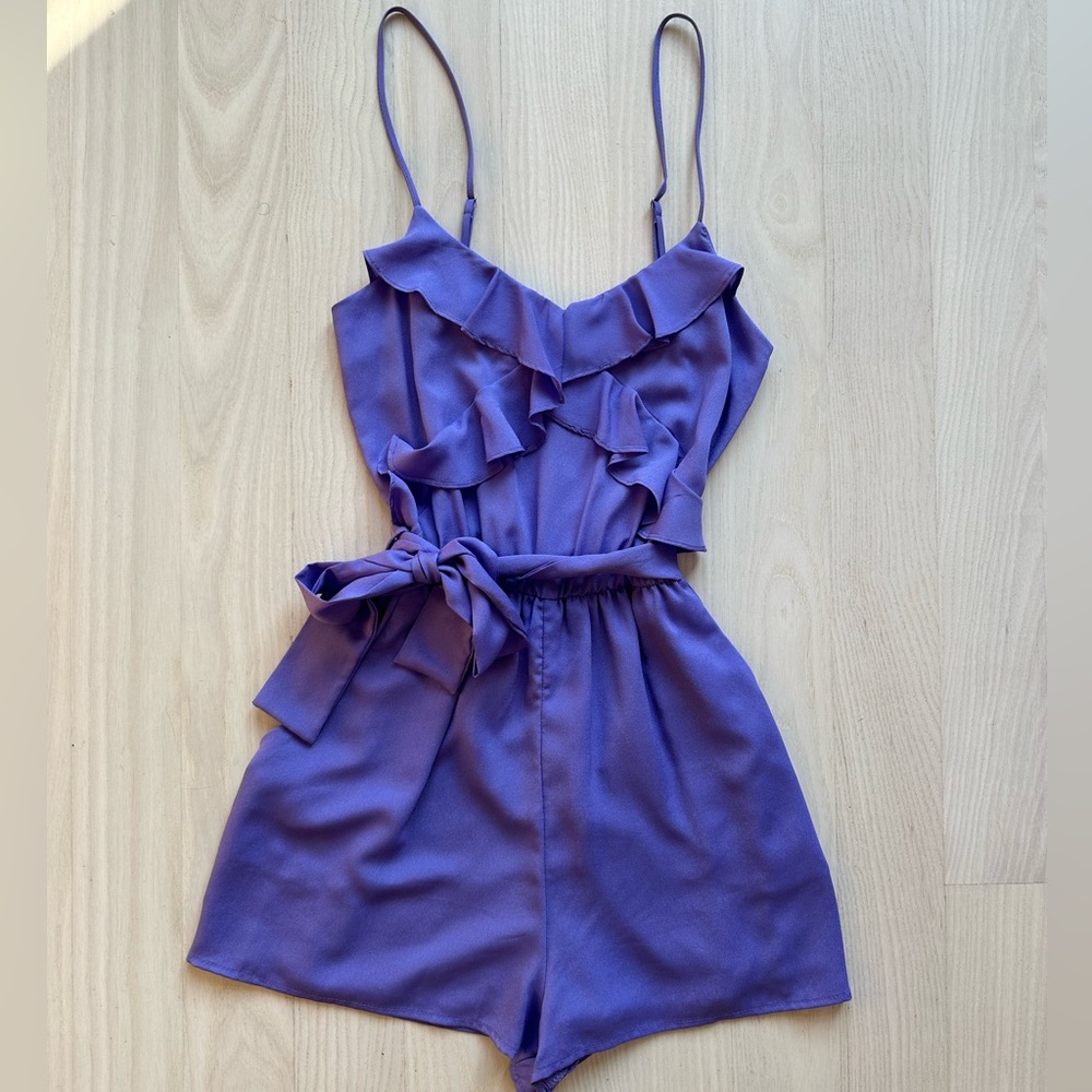 Lilac romper with ruffle detail